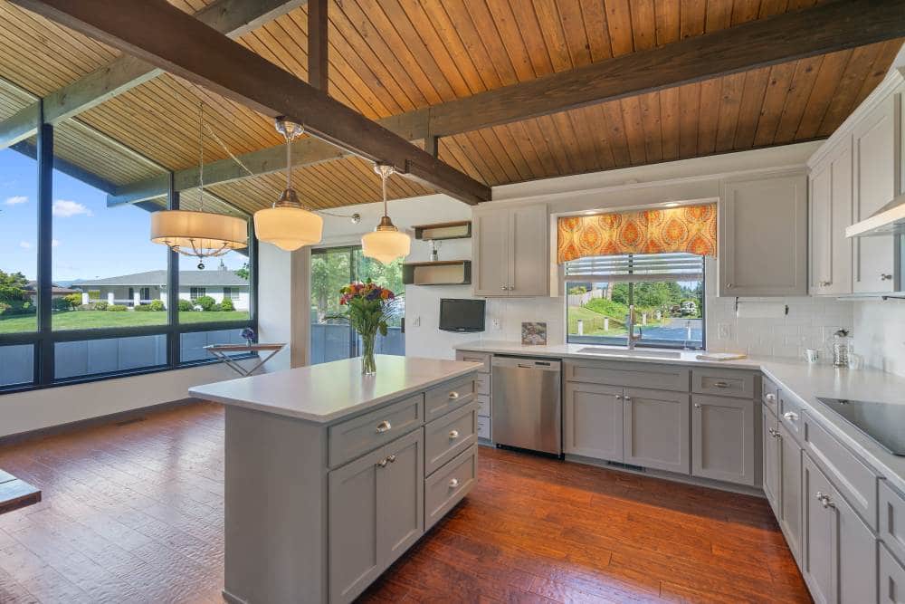 Grey and wooden kitchen with island