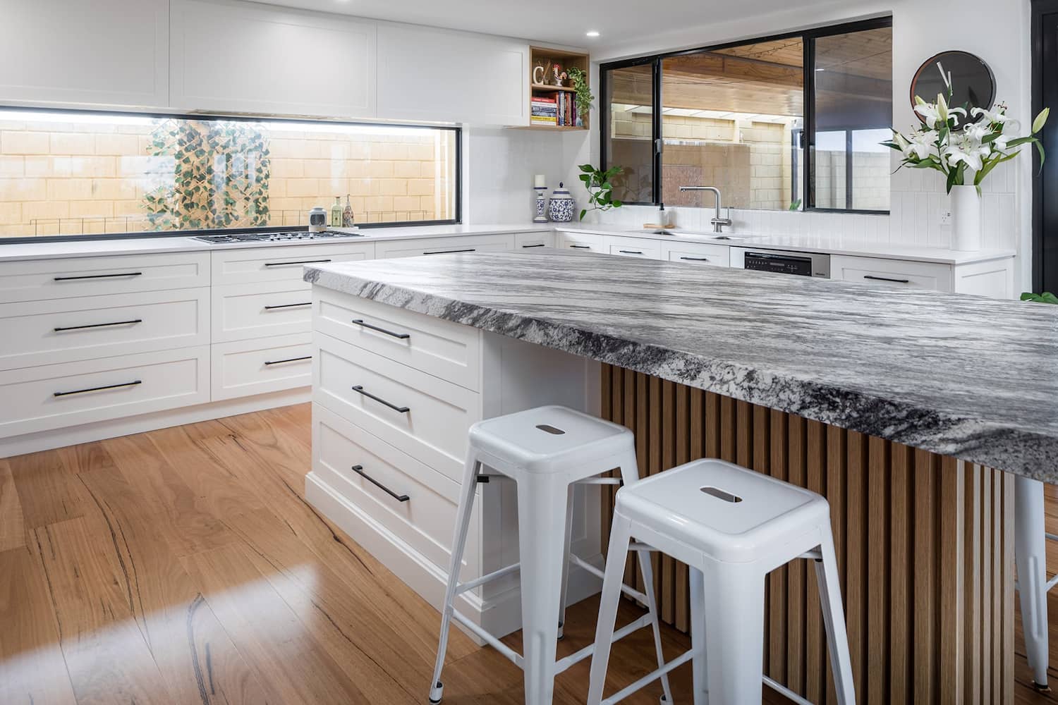 island kitchen with stone kitchen benchtop